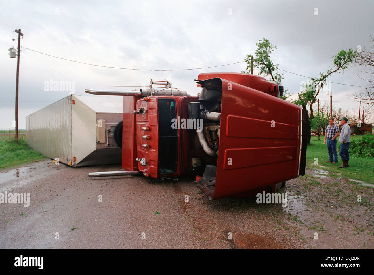 A Semi Truck is Flipped Over by a Tornado Stock Photo Alamy