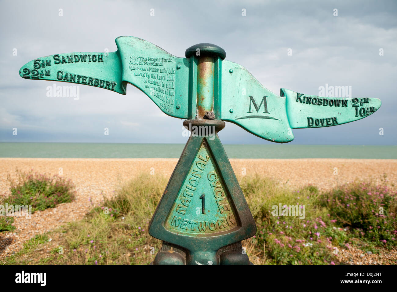An iron sign post marking the directions along the coastal path between Dover and Canterbury in Deal. Stock Photo