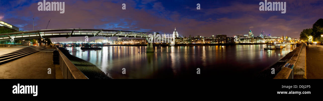 A panoramic view of the Millenium Bridge with St Paul's Cathedral in the distance. Stock Photo