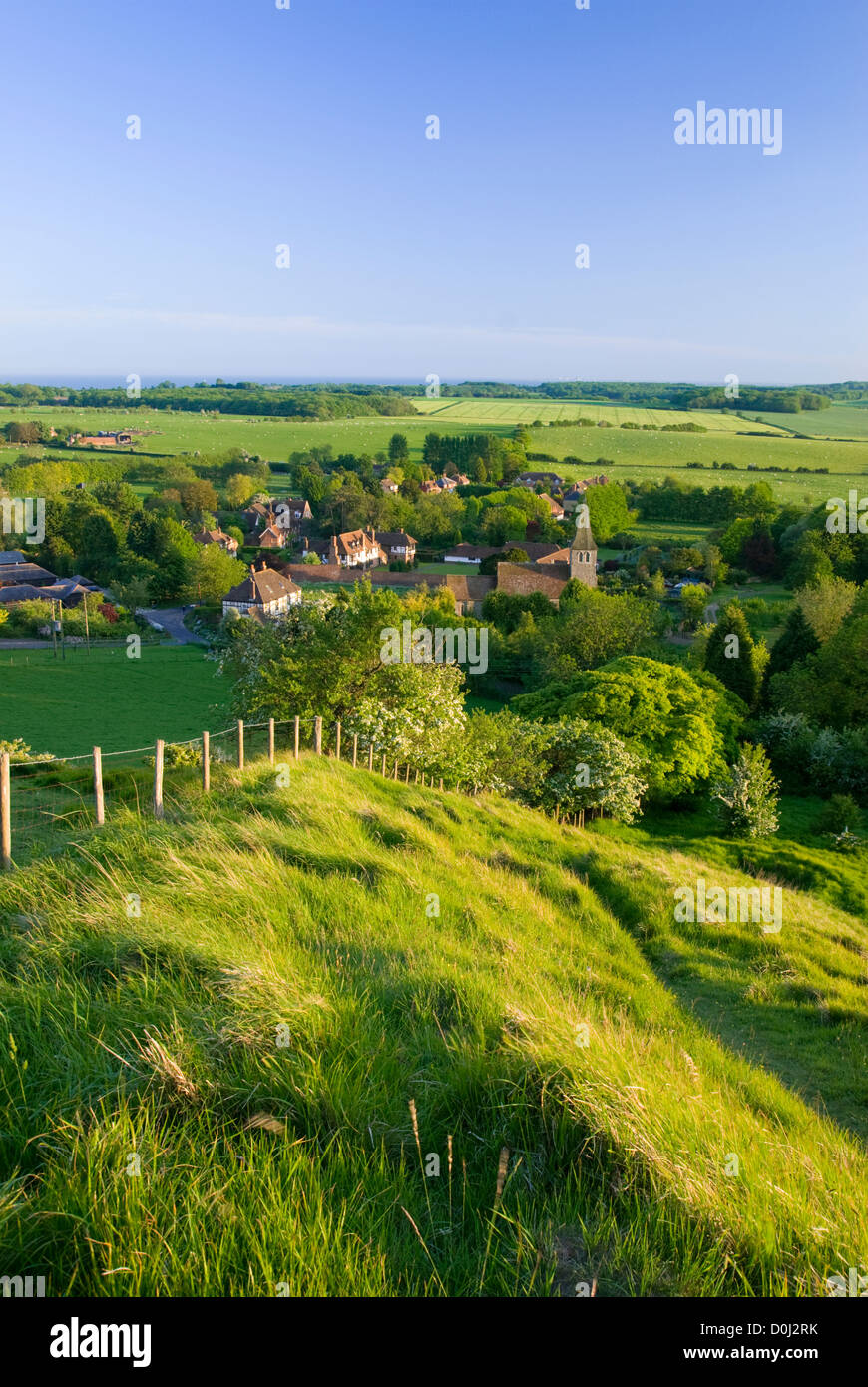 A view over the village of Postling at sunset. Stock Photo