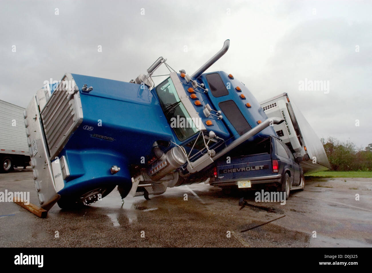 An SUV Is Crushed by a Semi Stock Photo