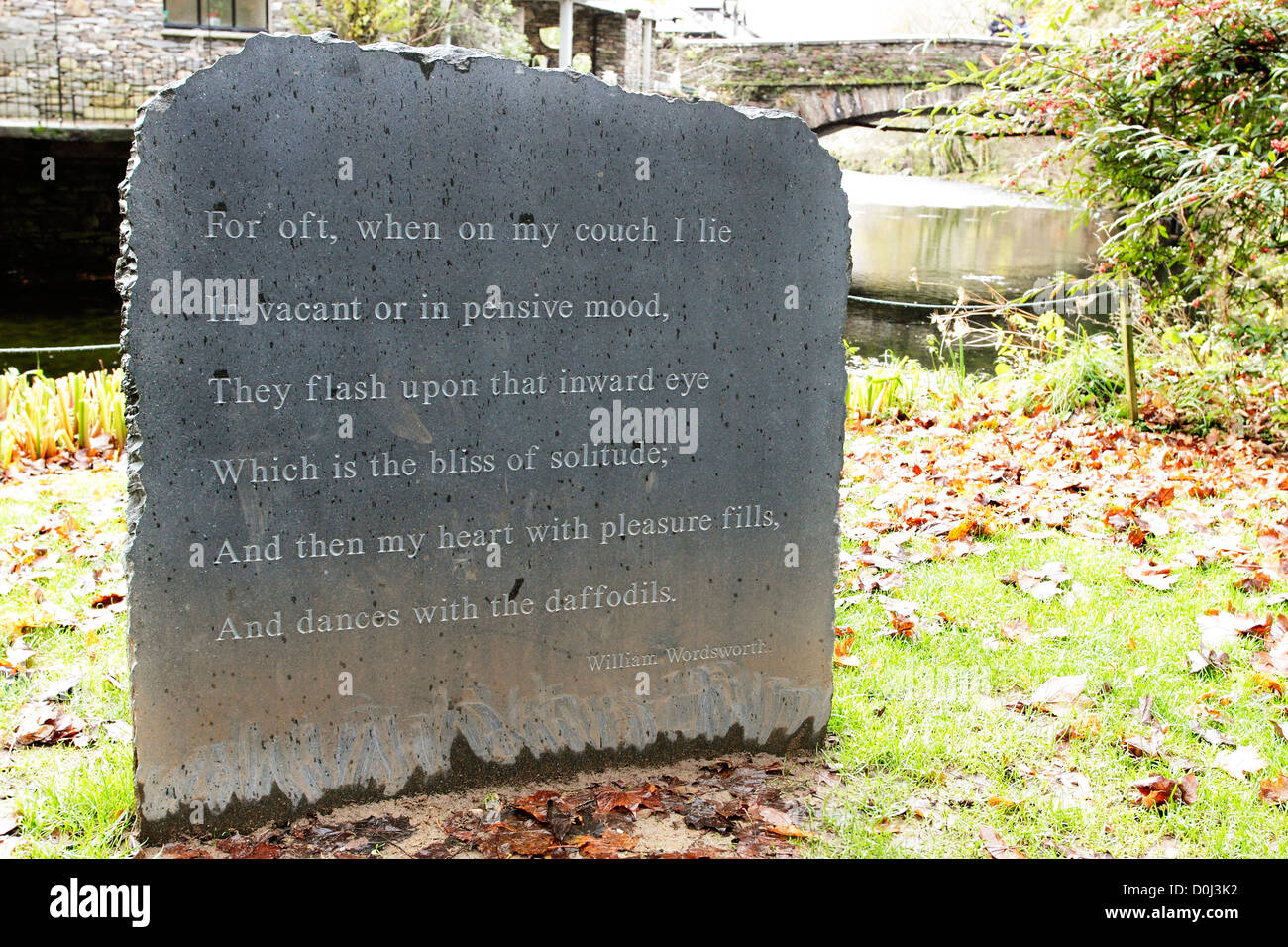 A stone in the churchyard in Grasmere with the words of the final verse of 'I Wandered Lonely As A Cloud' by William Wordsworth. Stock Photo