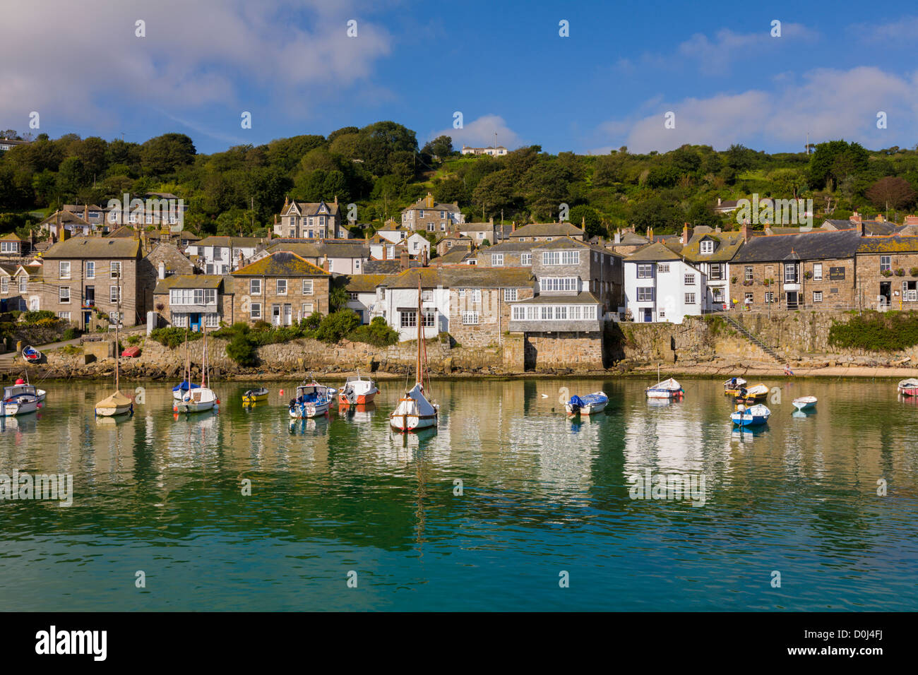 Yachts and boats moored in Mousehole harbour, Cornwall Stock Photo