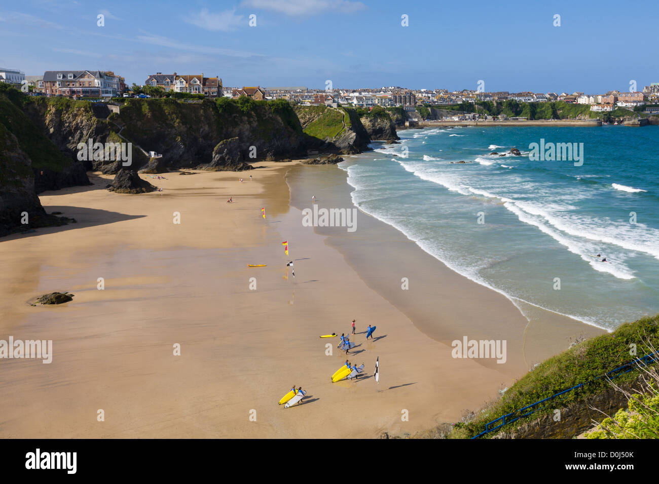 Surfers on beach at Great Western beach, Newquay, Cornwall, England Stock Photo