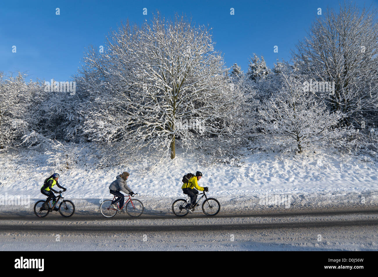 Three cyclists peddling through snow outside Worcester Stock Photo Alamy Three cyclists peddling through snow outside Worcester Stock Photo Alamy