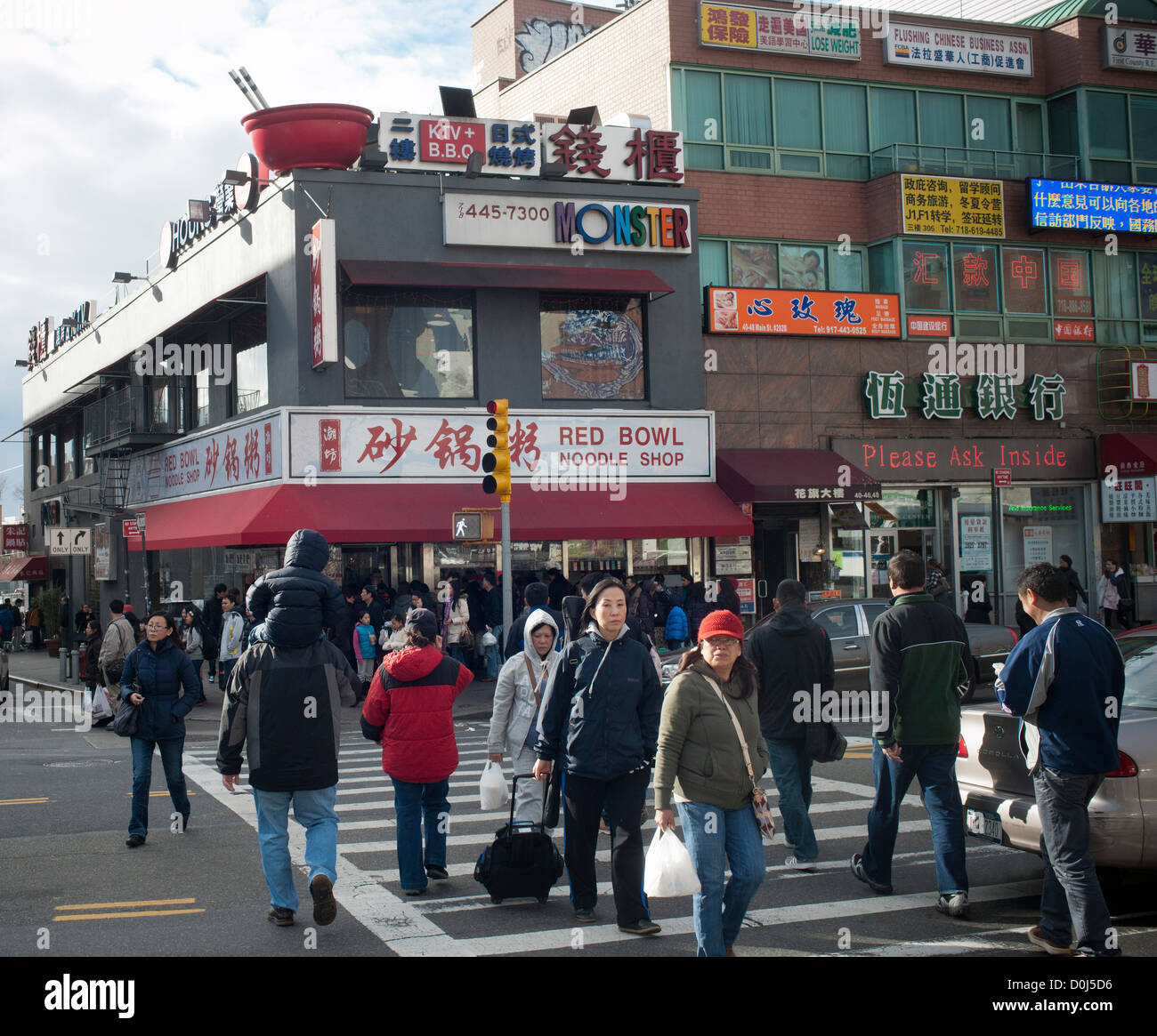 Shoppers in the busy Flushing neighborhood of Queens in New York Stock
