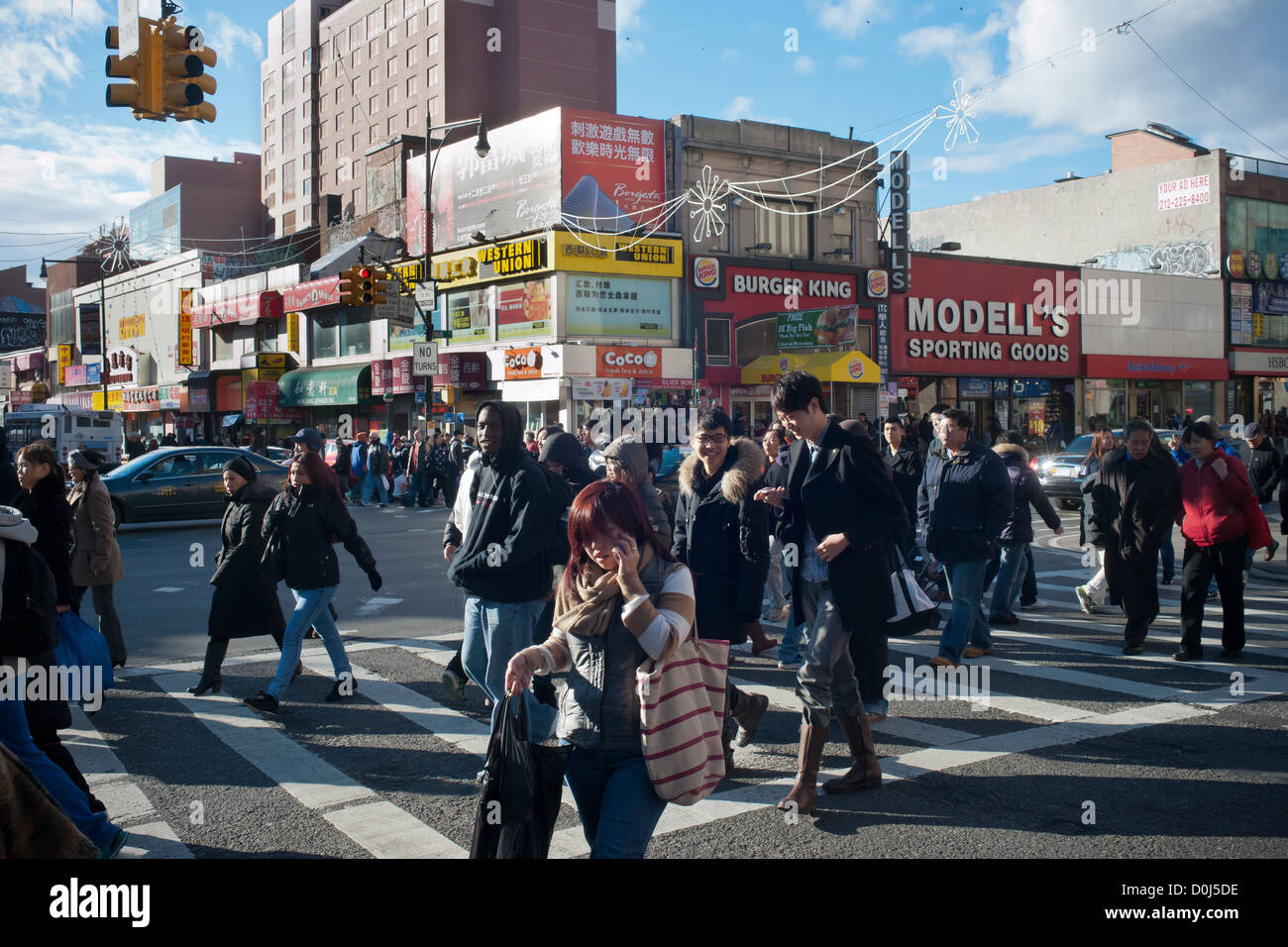 Shoppers in the busy Flushing neighborhood of Queens in New York Stock
