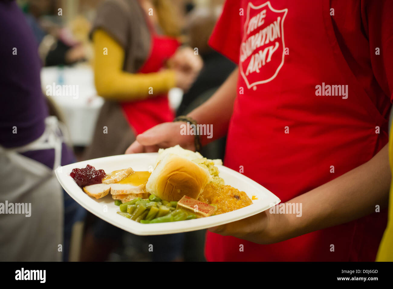 Volunteers for the Salvation Army serve Thanksgiving Dinner to the