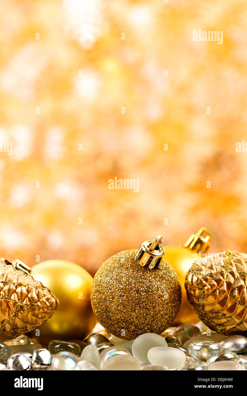 Golden Christmas background with ornaments and pine cones Stock Photo ...