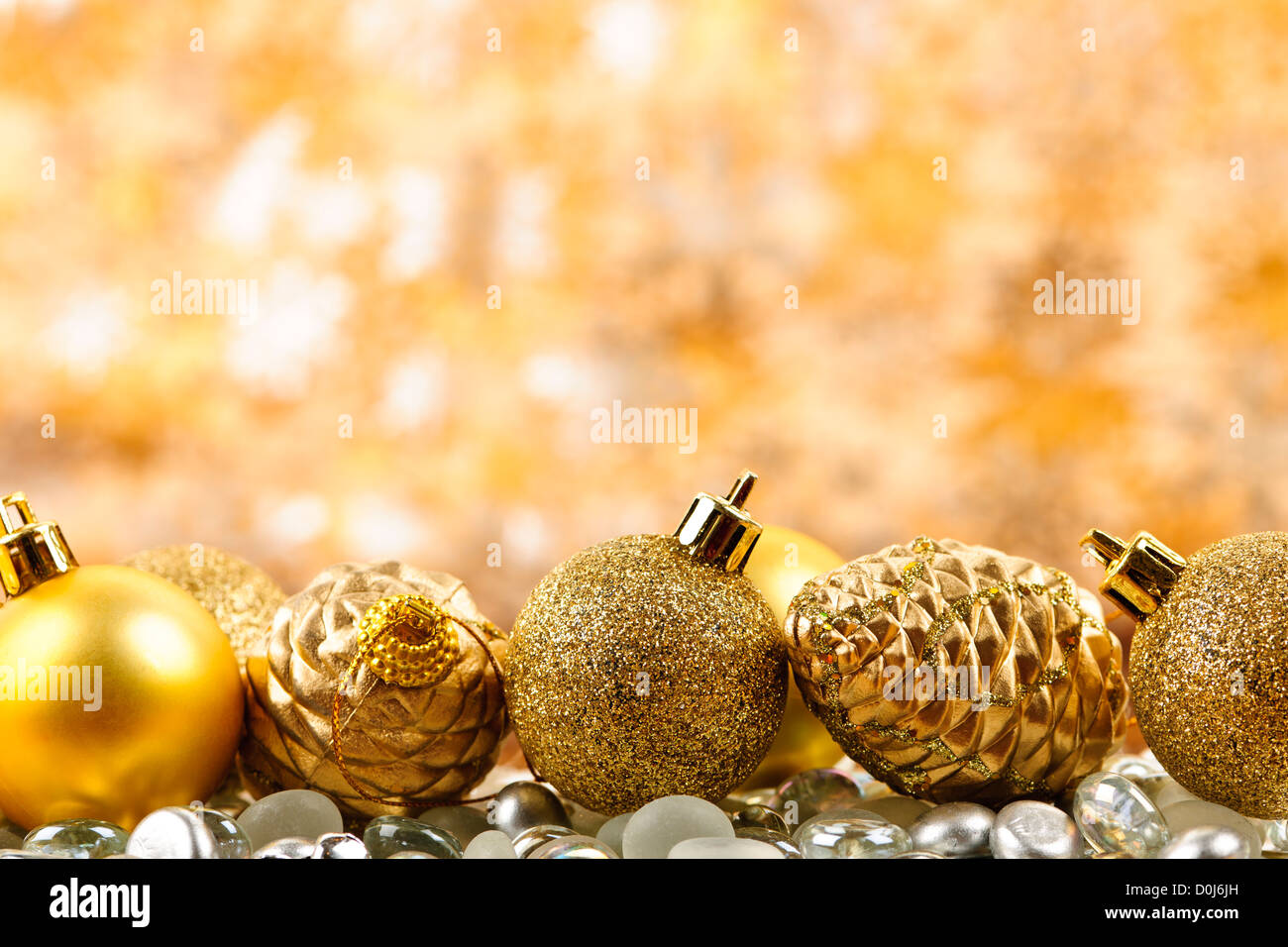 Golden Christmas background with ornaments and pine cones Stock Photo ...