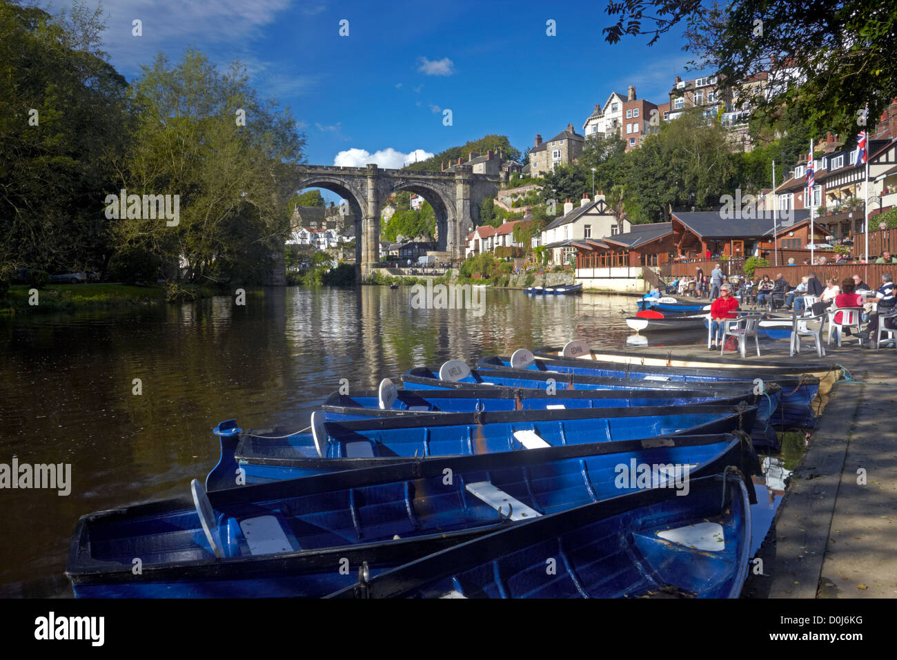Rowing boats on the River Nidd at Knaresborough with the Victorian railway viaduct in the background. Stock Photo