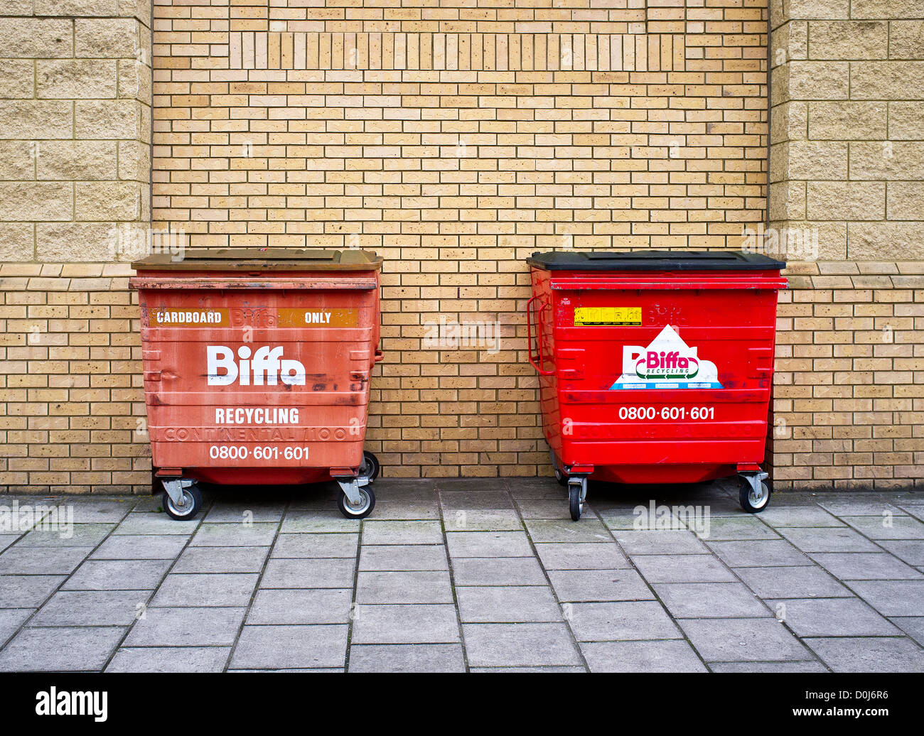 Recycling bins against brick wall hires stock photography and images