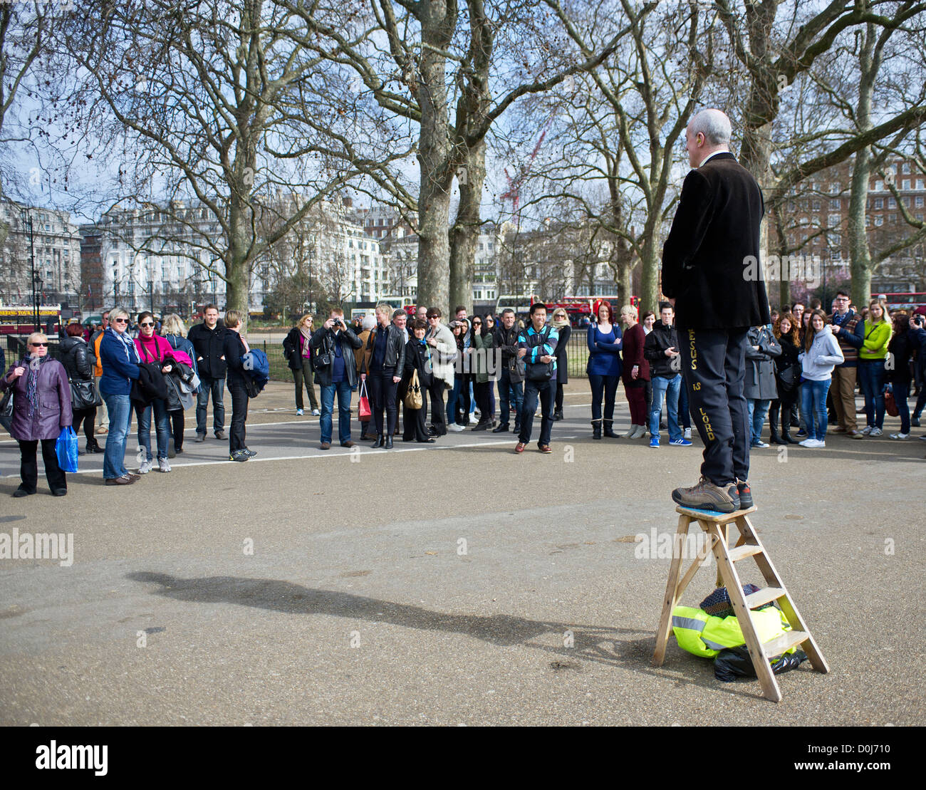 A man standing on wooden stepladder at Speakers Corner in London. Stock Photo