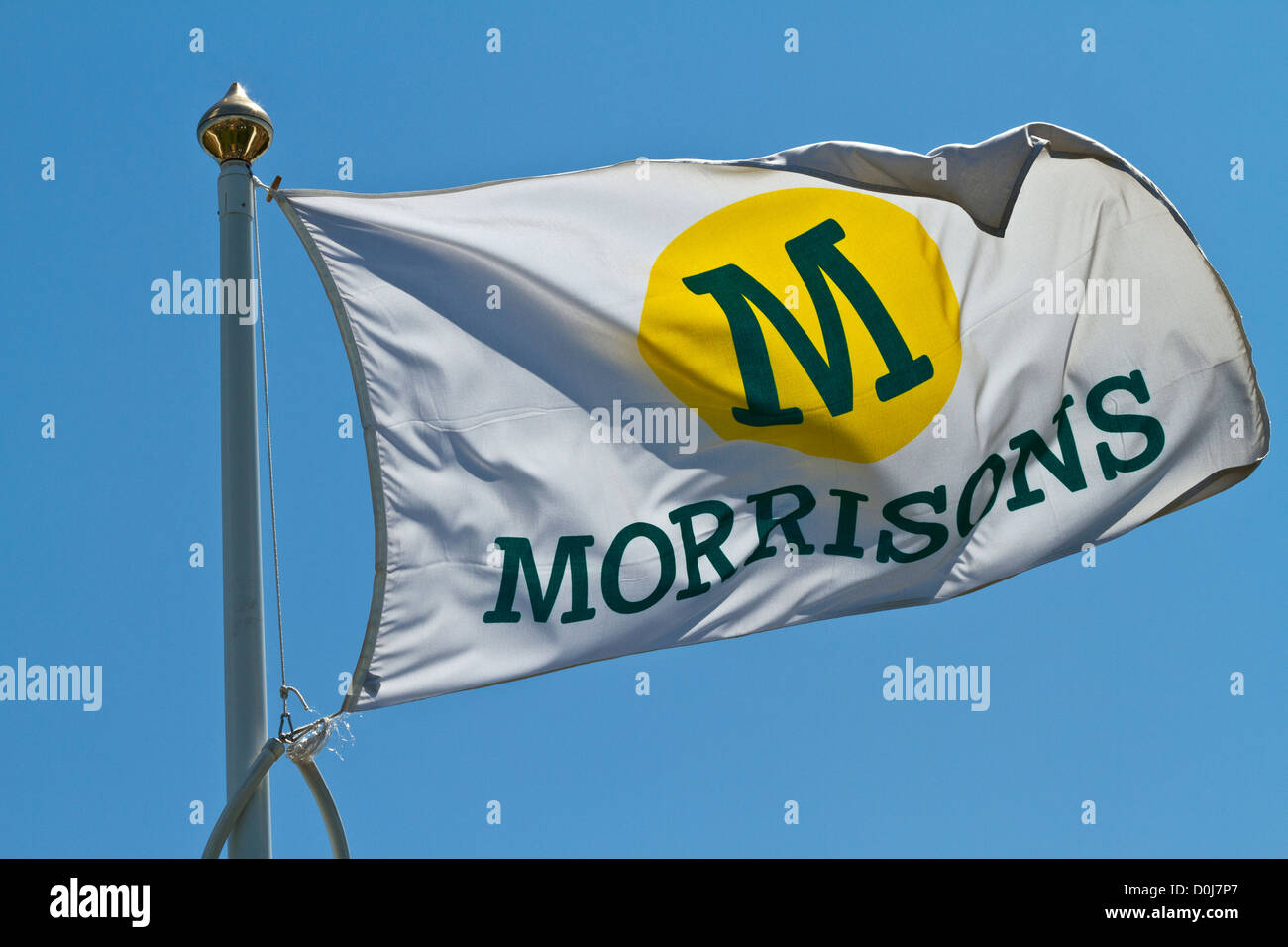 A Morrisons retailer flag fluttering outside a store in Hertfordshire. Stock Photo