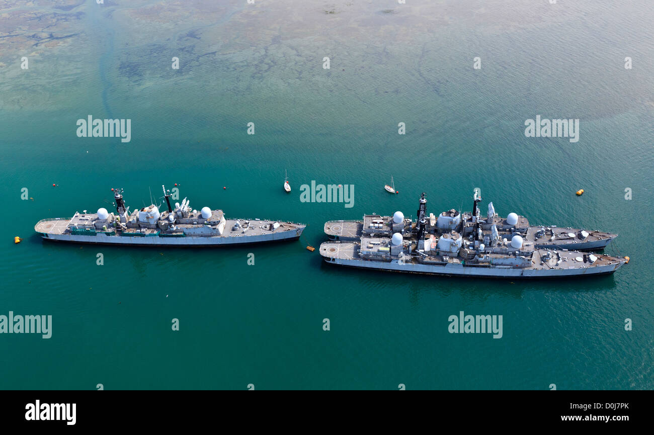 An aerial view of three decommissioned Royal Navy frigates awaiting their fate at anchor in Portsmouth. Stock Photo