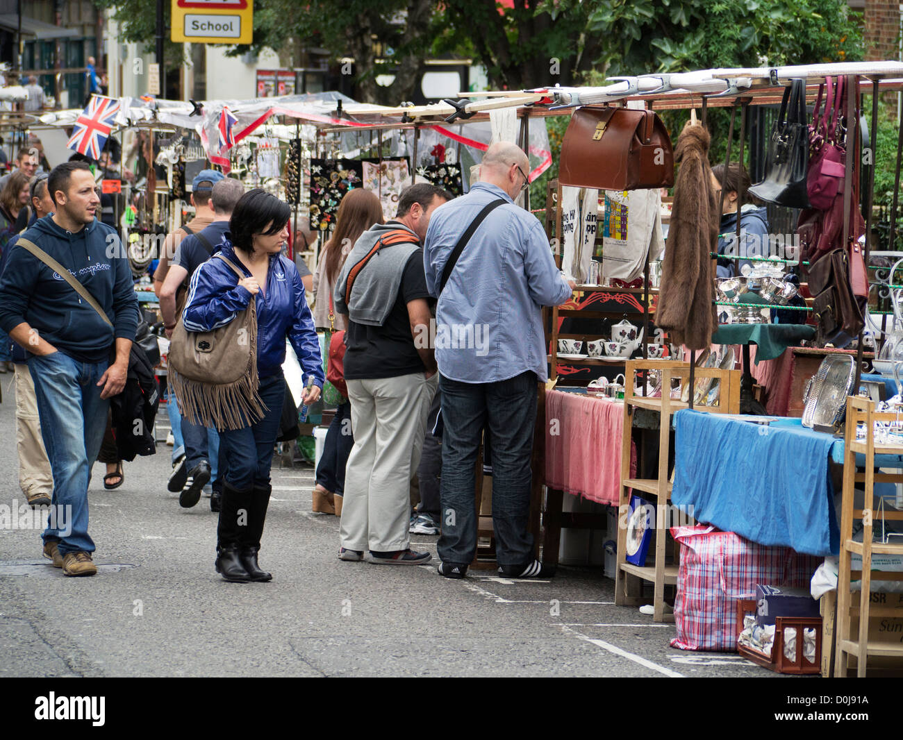 People browsing the stalls at the Portobello Road market in London. Stock Photo