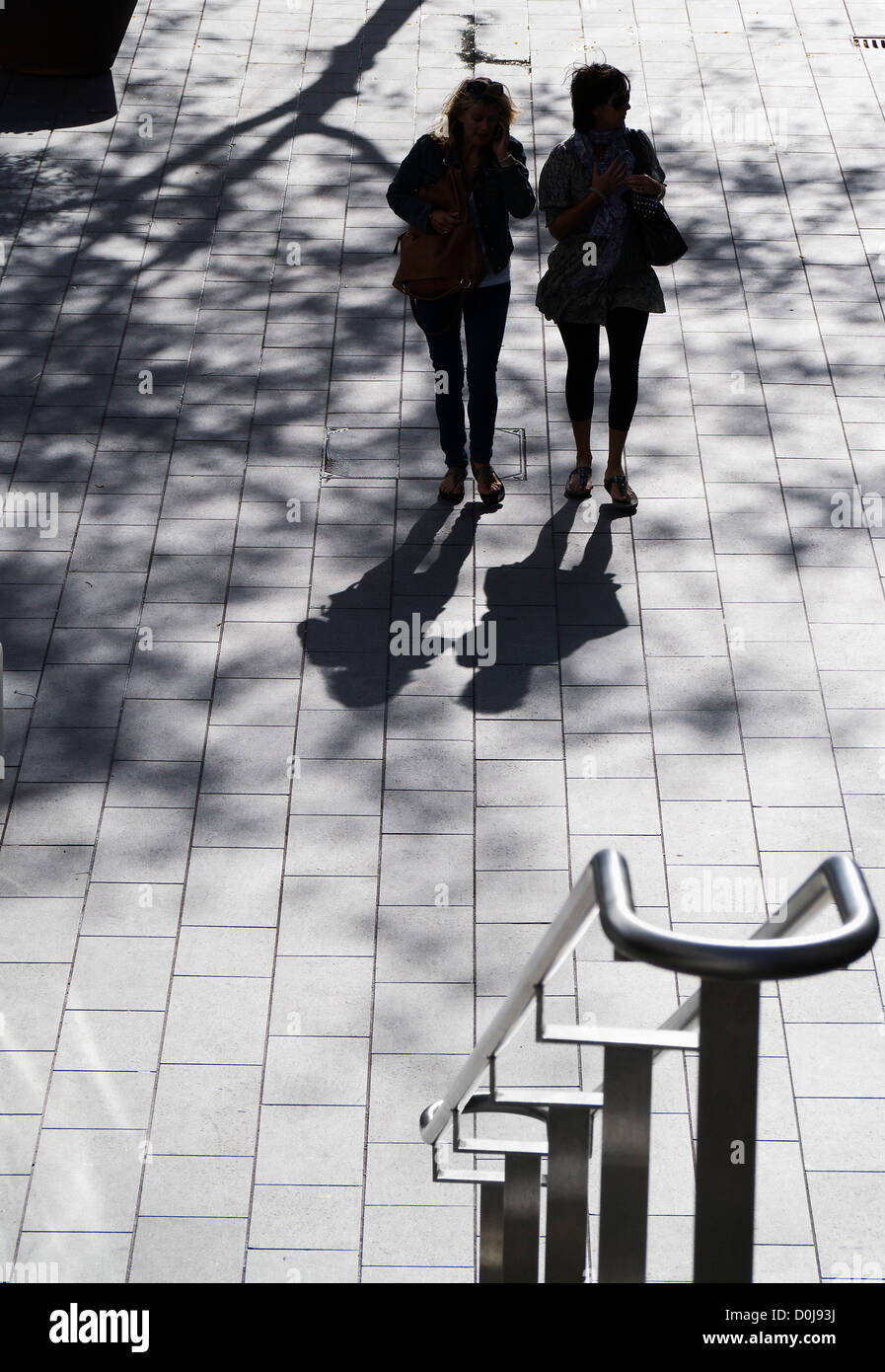 Two women near the steps of the Royal Festival Hall in London. Stock Photo