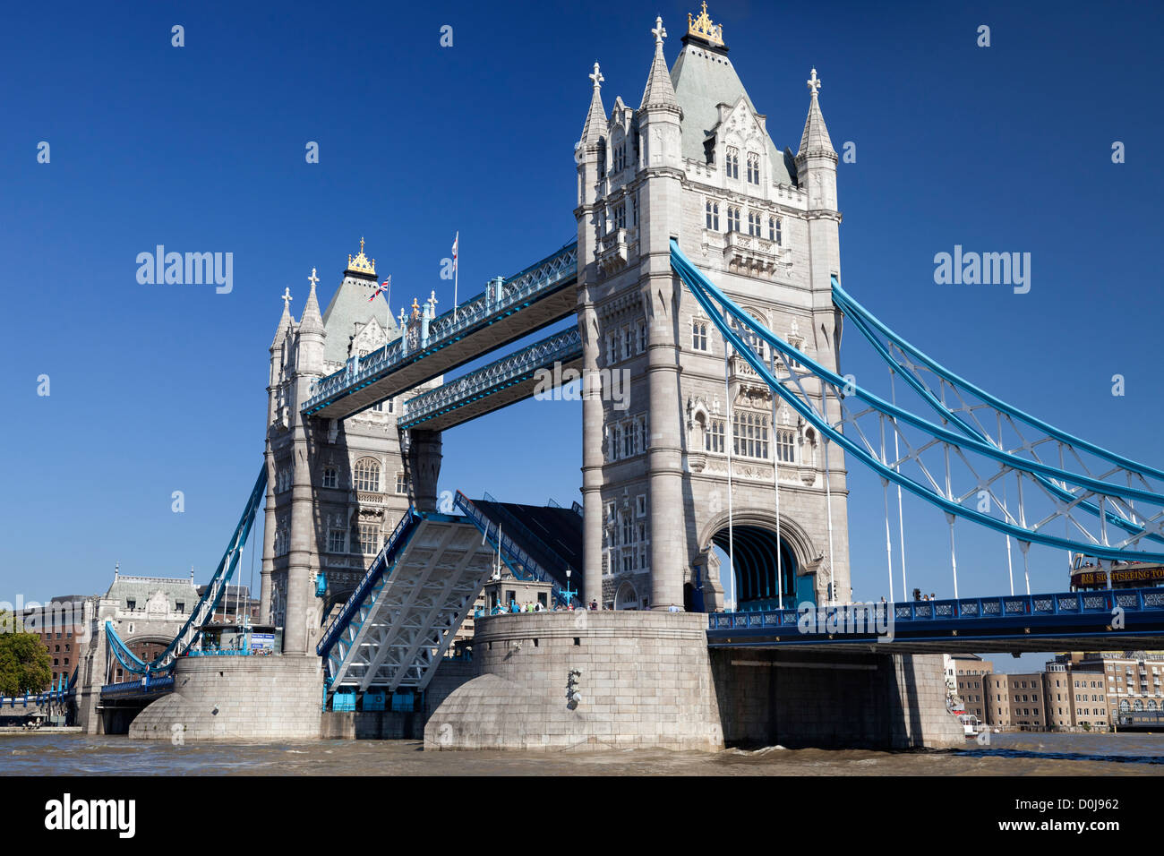 Tower Bridge during an autumn heat wave with centre span up. Stock Photo