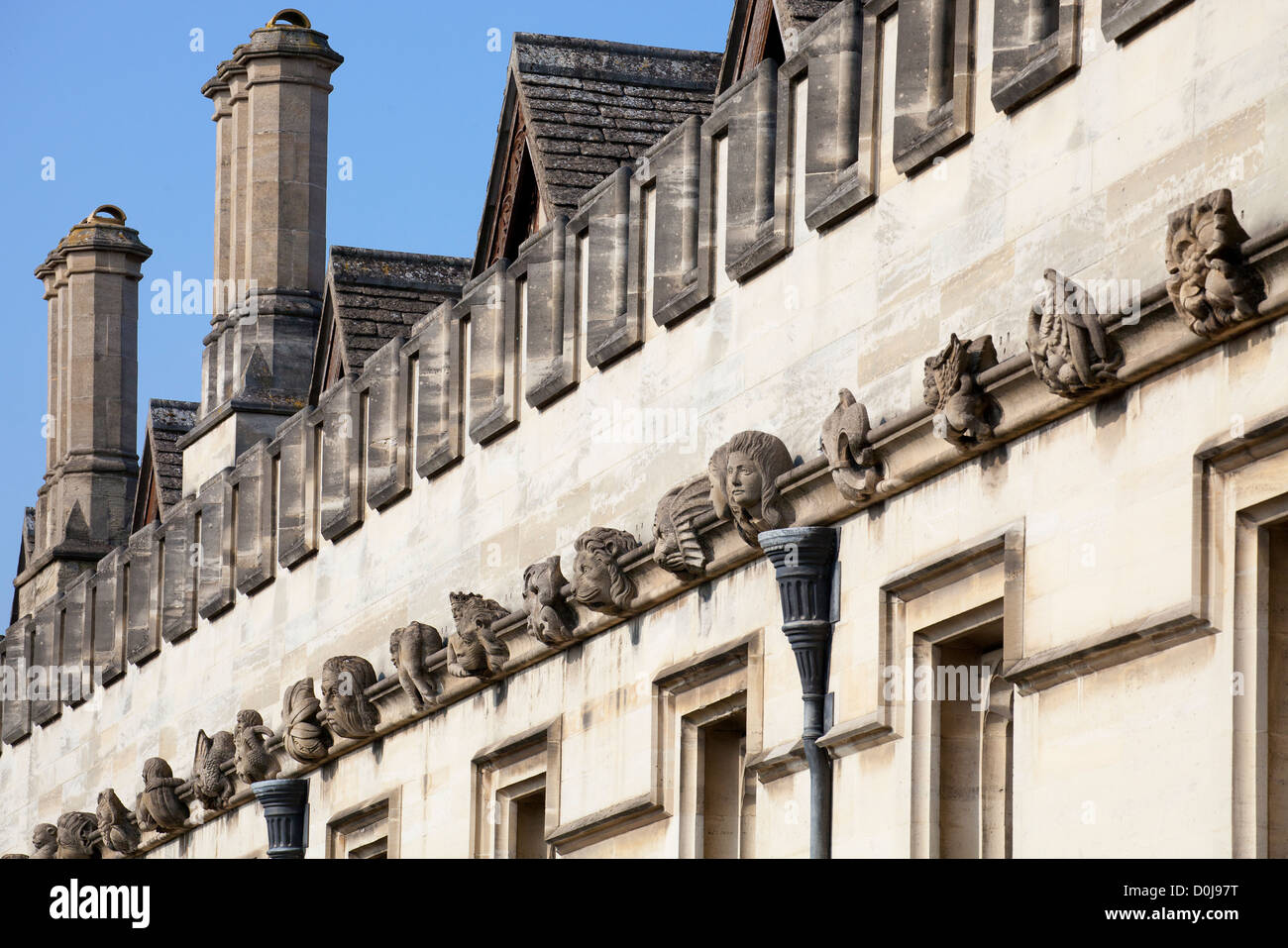 An array of gargoyles and exotics adorning the walls of Magdalen College in Oxford. Stock Photo