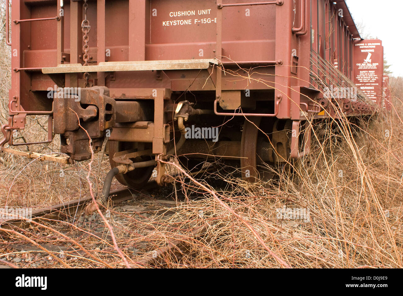 A train car sits on a little-used railroad siding in Massachusetts. Stock Photo