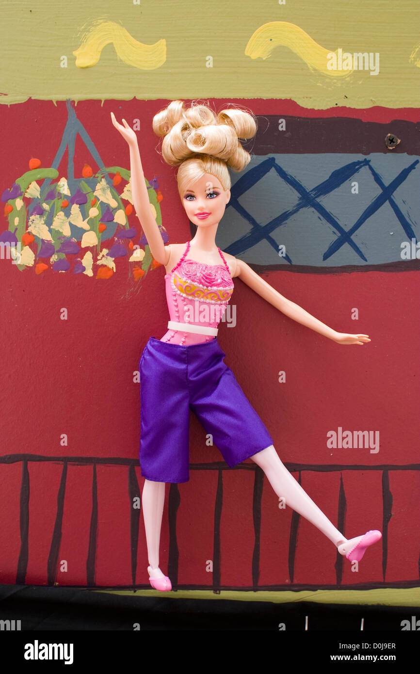 A Barbie doll is dressed in purple as part of the decorations of a float in Boston's 2010 Gay Pride March Stock Photo