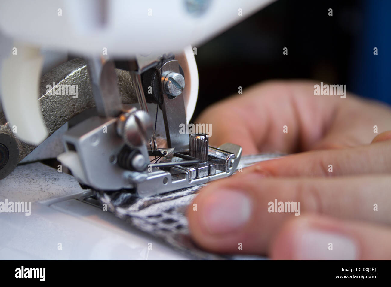 Closeup details of tailors work on a sewing machine. This is how