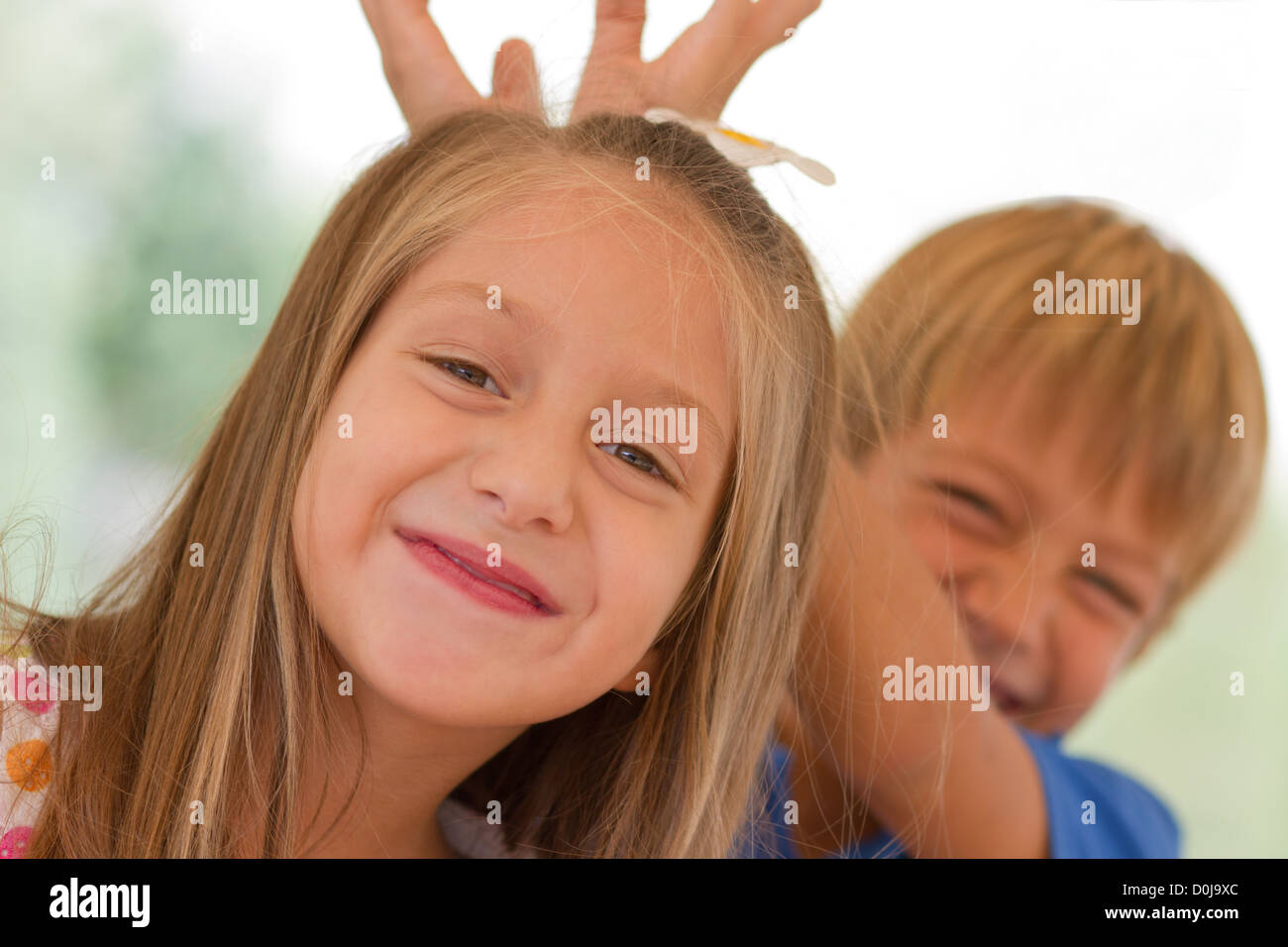Cute little children on the playground at bright summer day Stock Photo ...