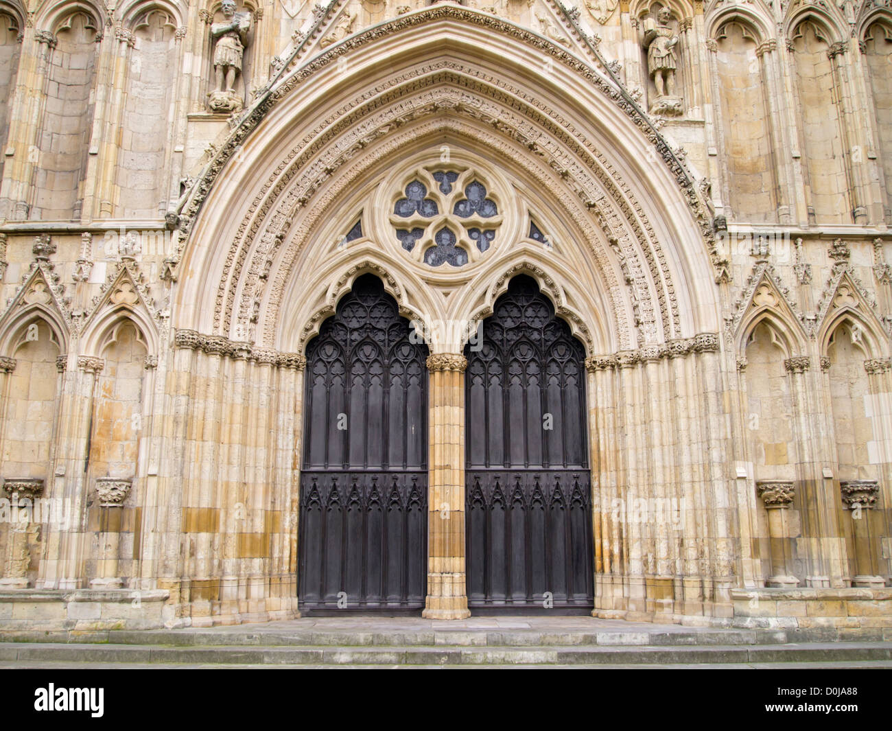 Grand door and arch on the West Front entrance of York Minster. Stock Photo