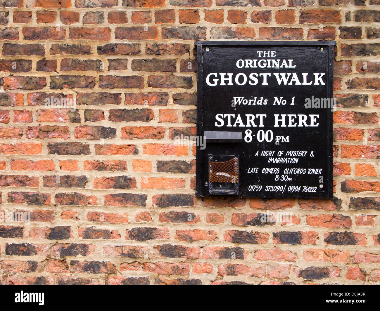 Ghost Walk starting point sign on a wall near the River Ouse. Stock Photo