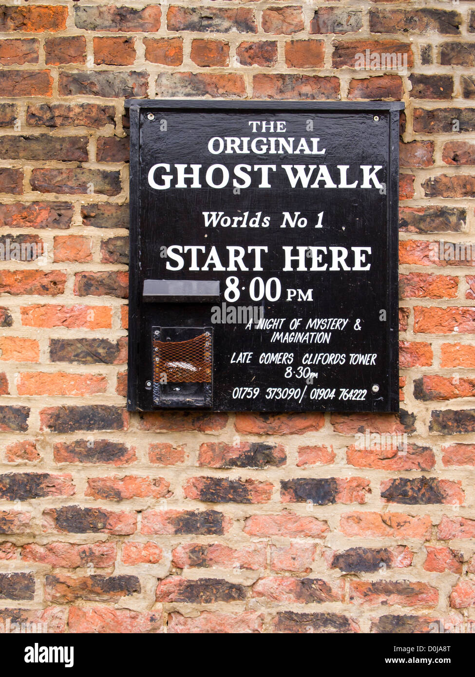 Ghost Walk starting point sign on a wall near the River Ouse. Stock Photo