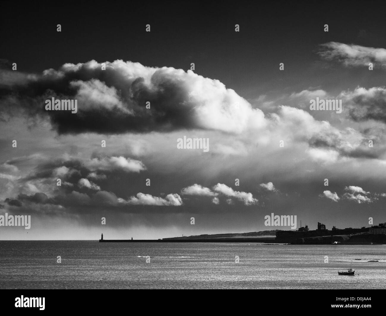 View looking south from headland near Cullercoats towards the Mouth of the Tyne and Tynemouth Priory. Stock Photo