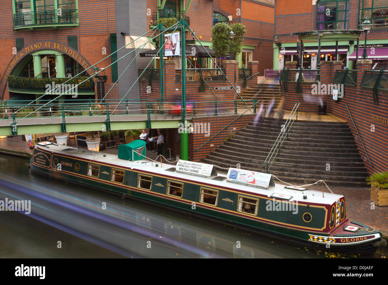 Narrow boat moored on a canal at Brindley Place in Birmingham City. Stock Photo