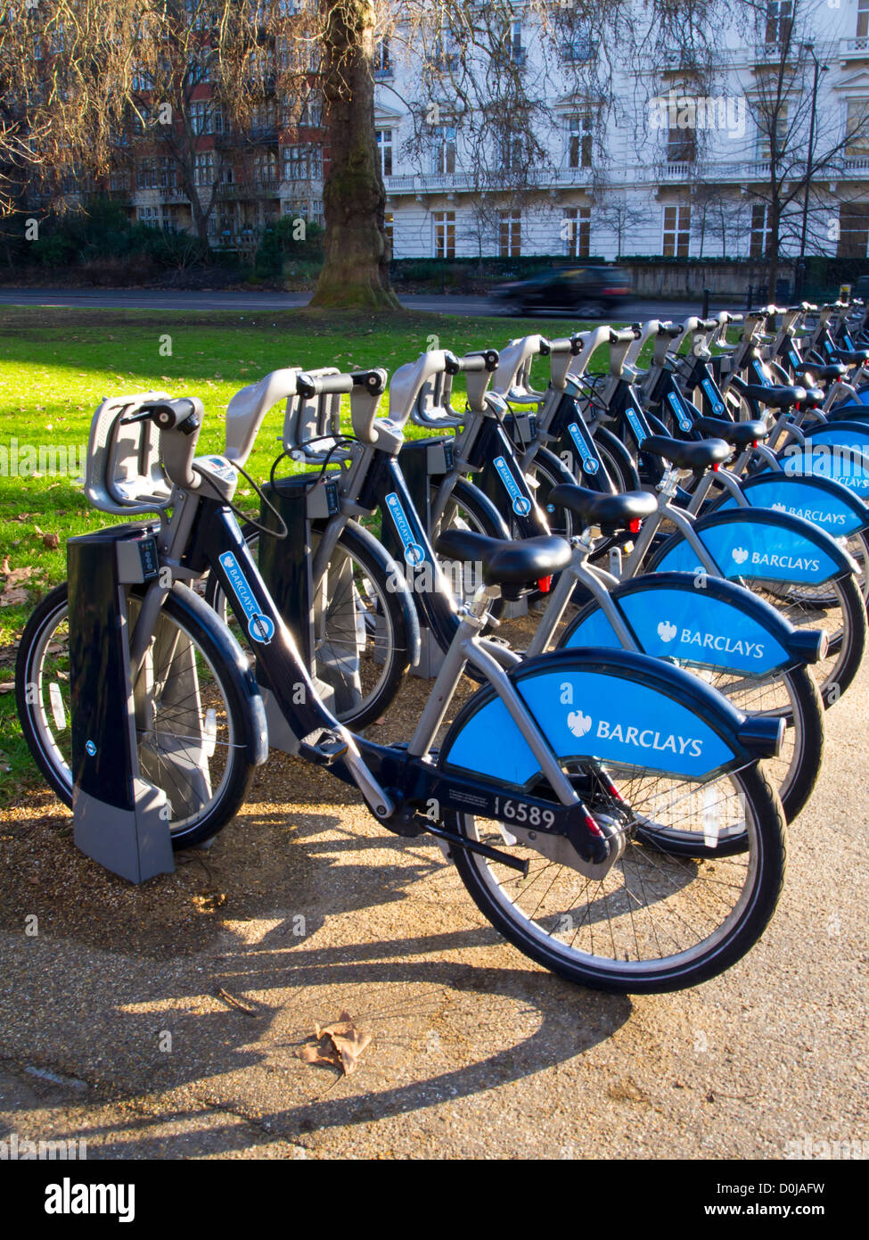 Rows of bikes at Barclays cycle hire docking station in Hyde Park. Stock Photo