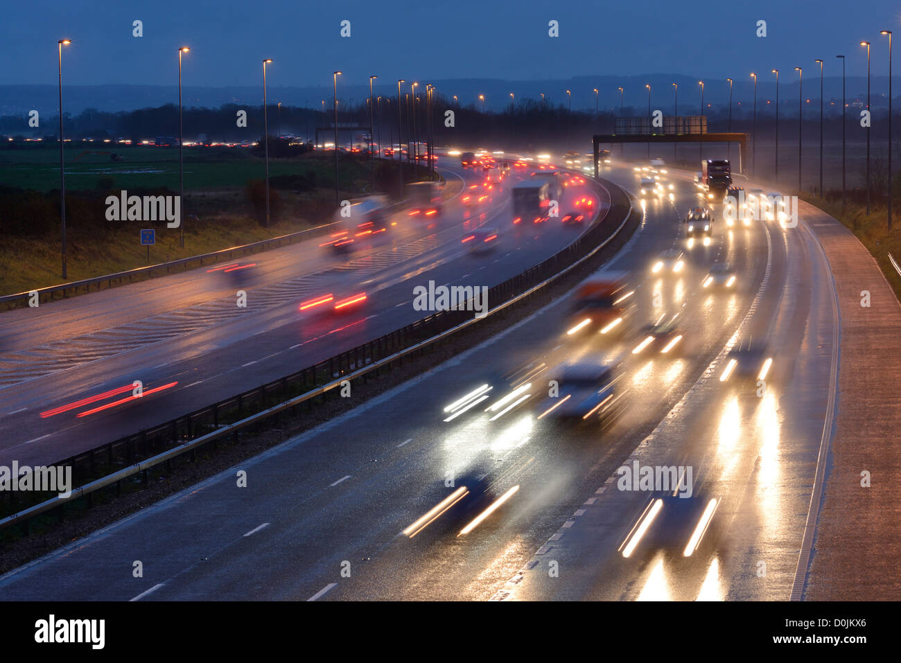 M56 motorway rush hour traffic on a wet evening Stock Photo