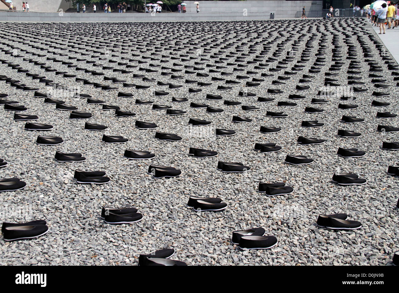 People visit the Nanjing Massacre Memorial Hall as 6,830 laborers shoes lay on the Peace Square to mourn the war victims during Stock Photo