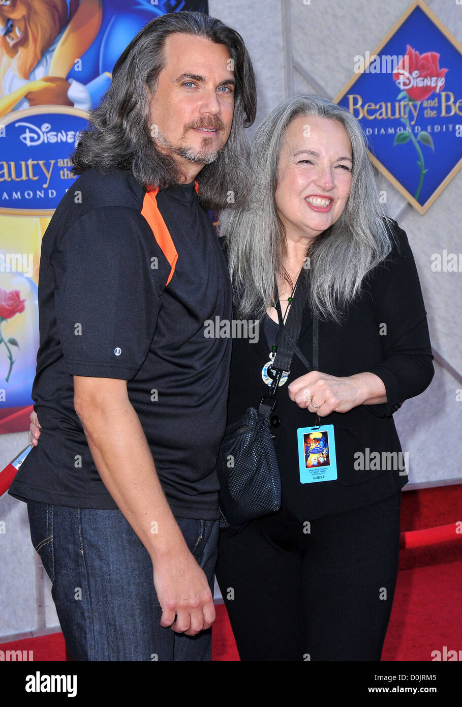Robby Benson and wife Karla Devito A Sing-A Long Premiere of 'Beauty and  the Beast' Diamond Edition held at the El Capitan Stock Photo - Alamy
