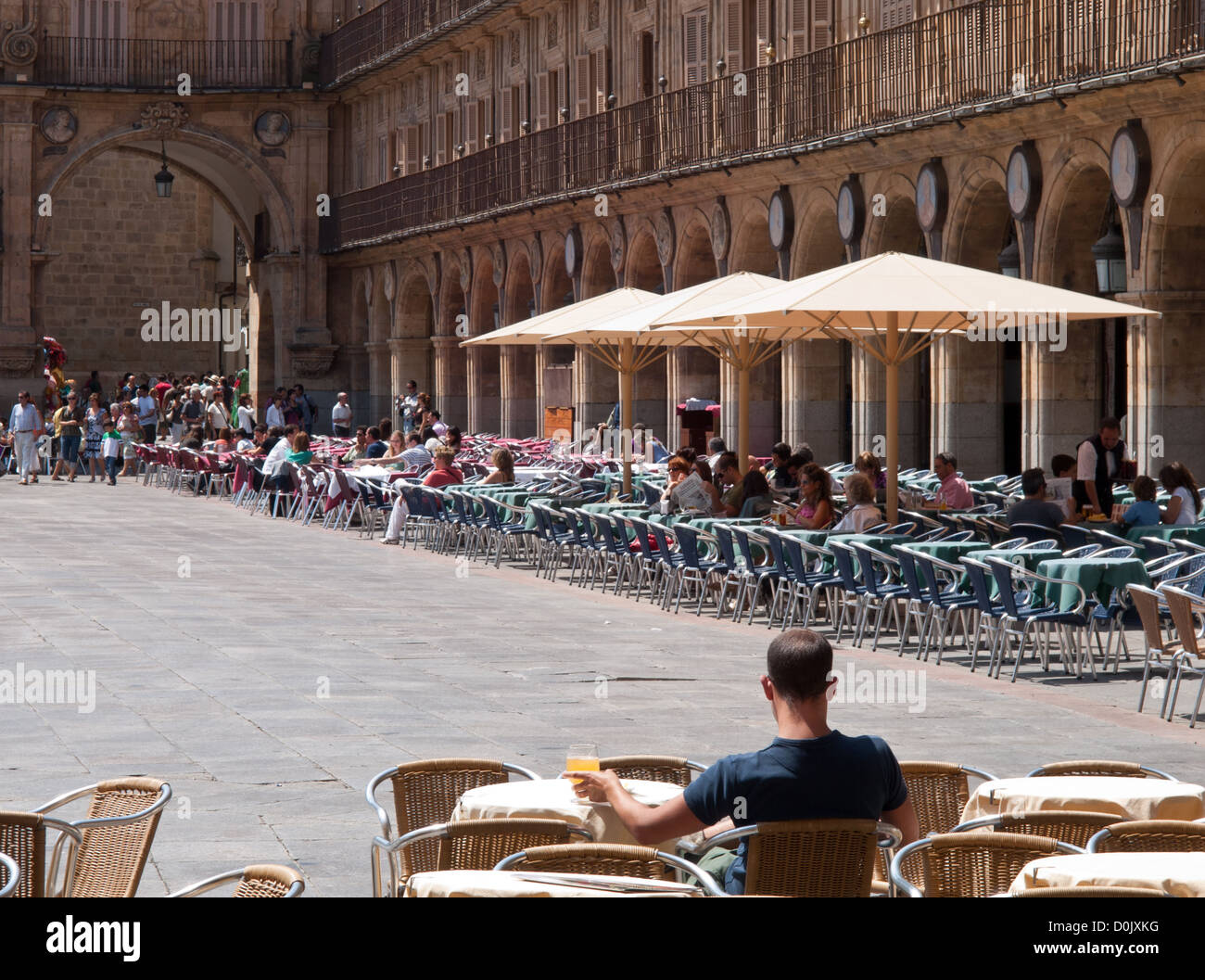 Man enjoying a drink in a restaurant at the Plaza Mayor (English Main