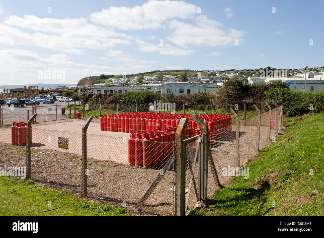 Propane gas cylinders stocked near holiday caravans on Sandy Bay in the South West of the UK Stock Photo