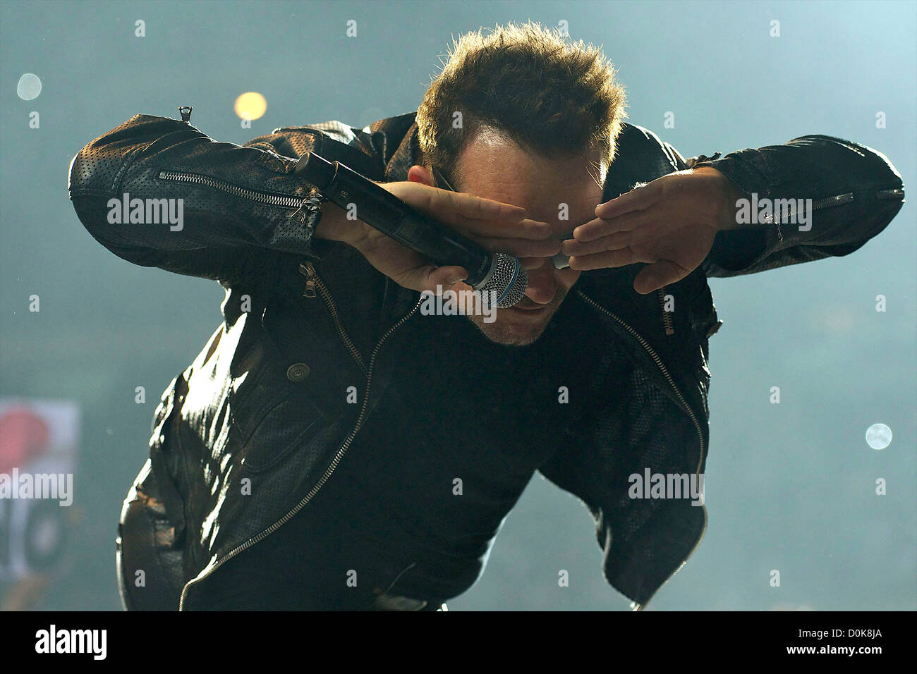 Bono of rock band U2 performs on stage during the U2 360 Tour concert at the Estadio Olimpico. Seville, Spain - 30.09.10 Stock Photo
