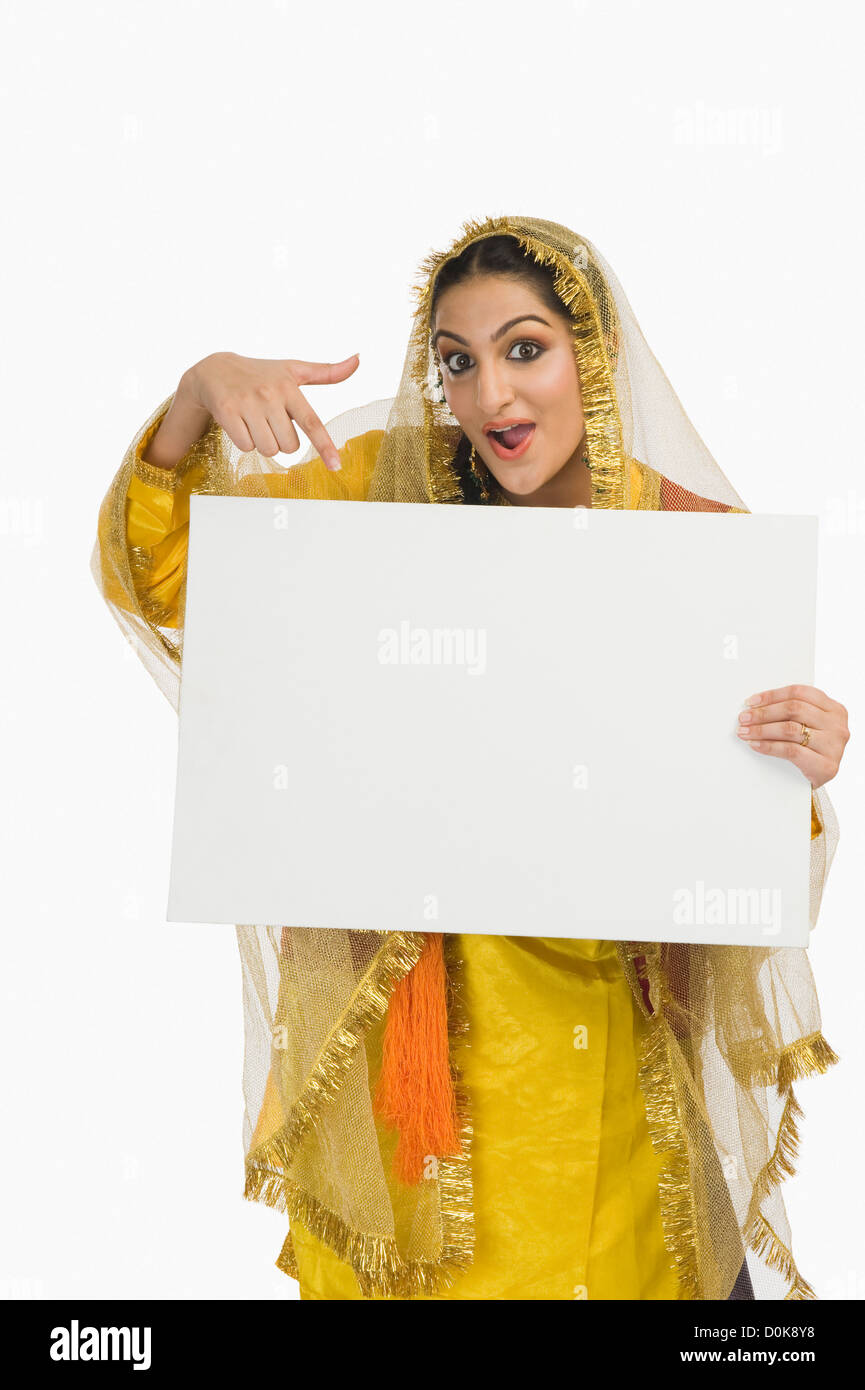Woman in traditional Punjabi dress holding a placard Stock Photo Alamy