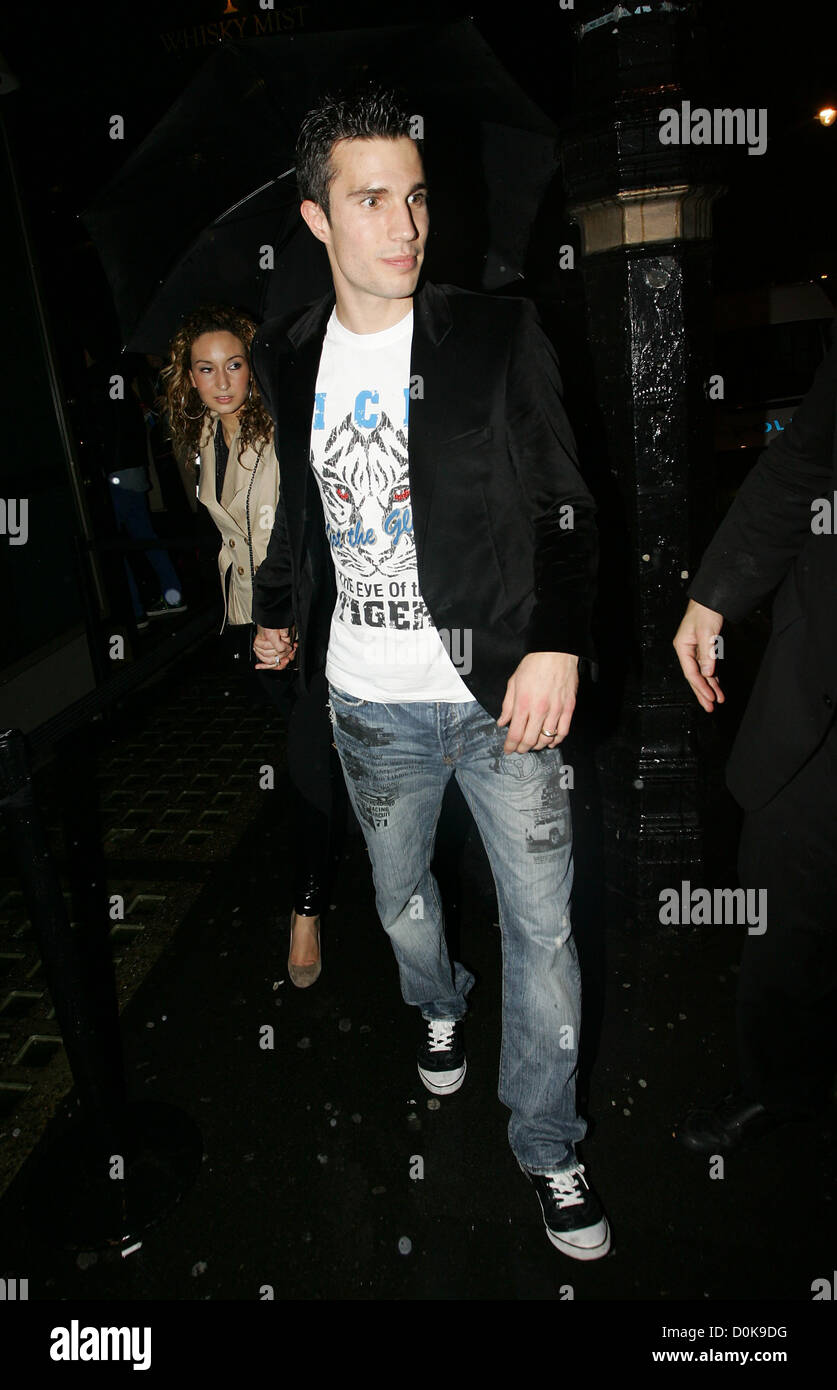 Footballer Robin van Persie of Arsenal and his wife Bouchra leaving Whisky Mist night club. London England Stock Photo