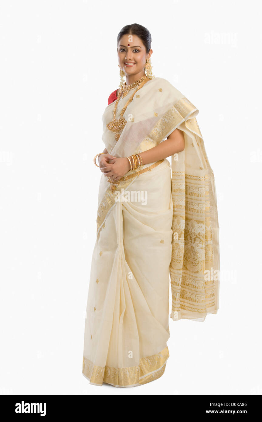 Portrait of a South Indian woman wearing jewelry and sari Stock Photo ...