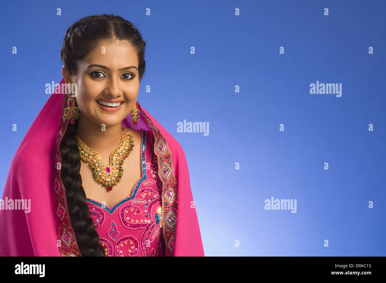 Portrait of a woman in traditional dress and smiling Stock Photo - Alamy