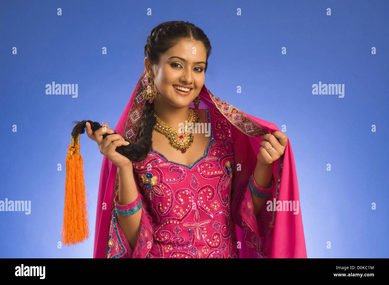 Portrait of a woman in traditional dress and smiling Stock Photo - Alamy