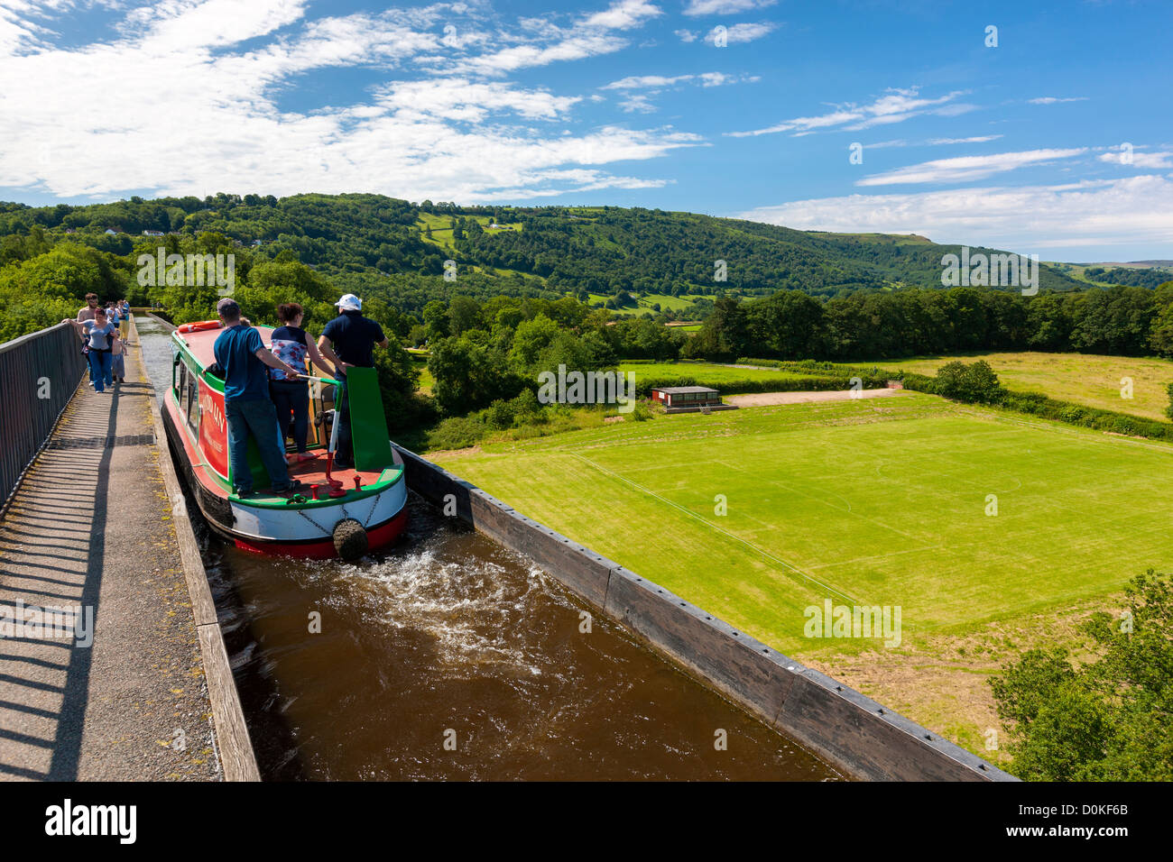 A barge travelling along the Pontcysyllte aquaduct which is a navigable aqueduct that carries the Llangollen Canal over the vall Stock Photo