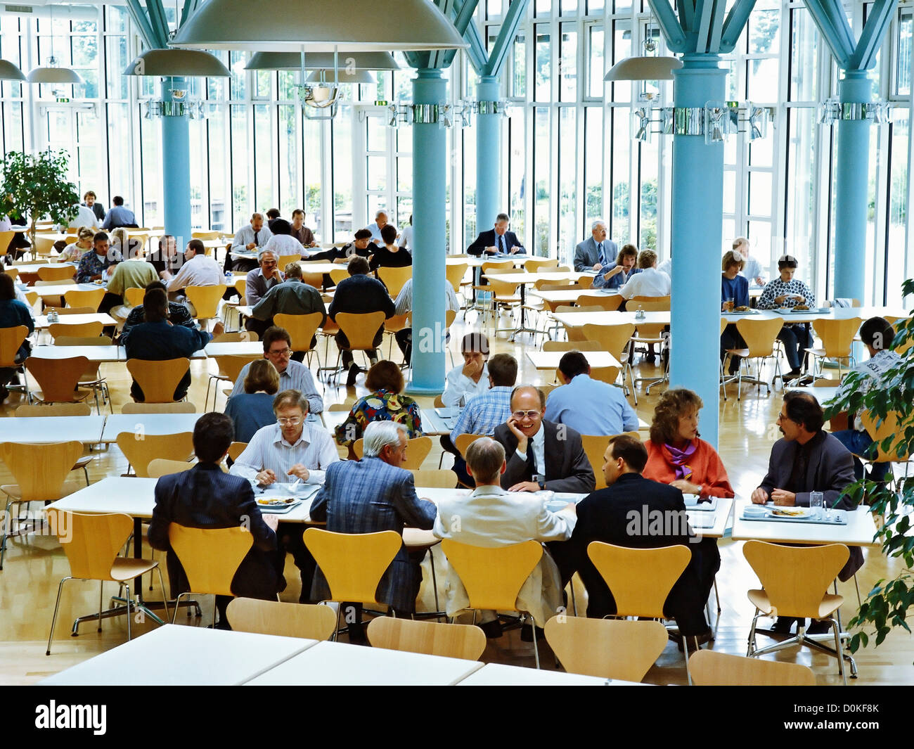 Workers having lunch in a company canteen Stock Photo Alamy