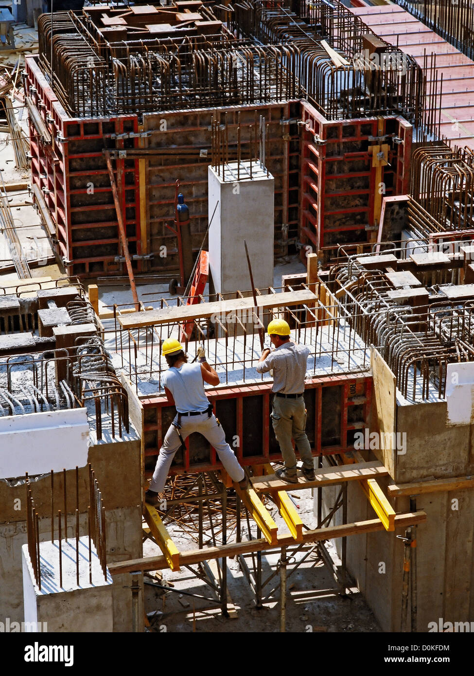 Workers building a steelreinforced concrete structure Stock Photo Alamy