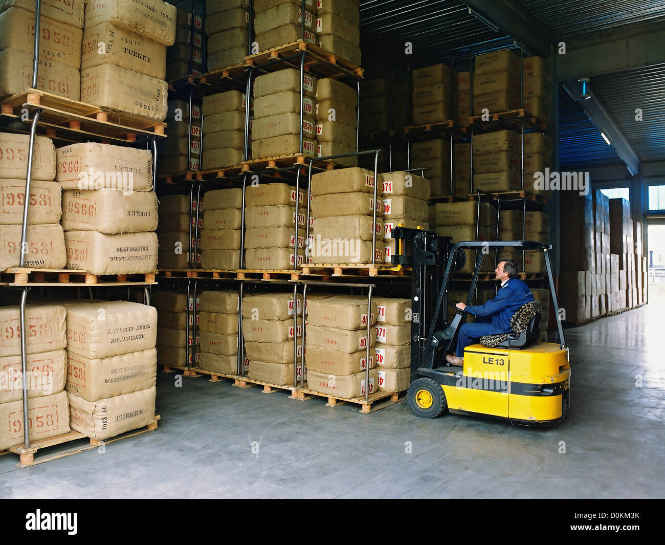 bales of tobacco Transporting bales of tobacco in a warehouse by fork-lift truck Stock Photo