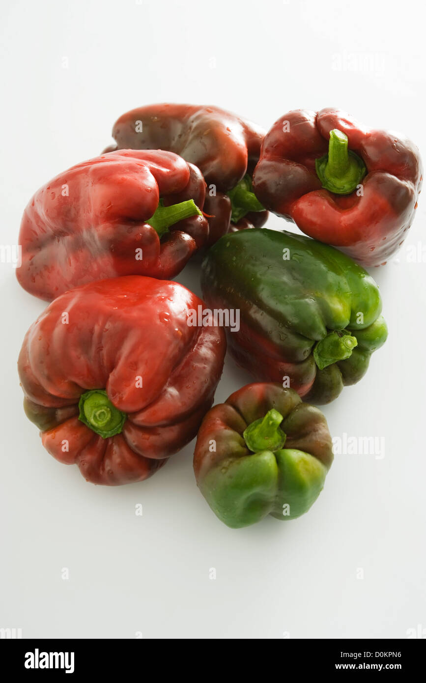 Red and green peppers on white background Stock Photo - Alamy