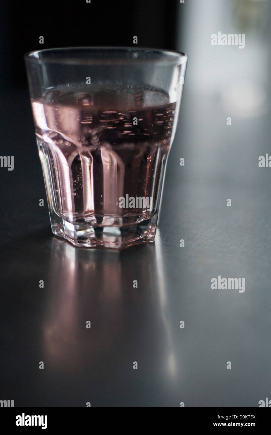 Glass of water rose syrup Stock Photo